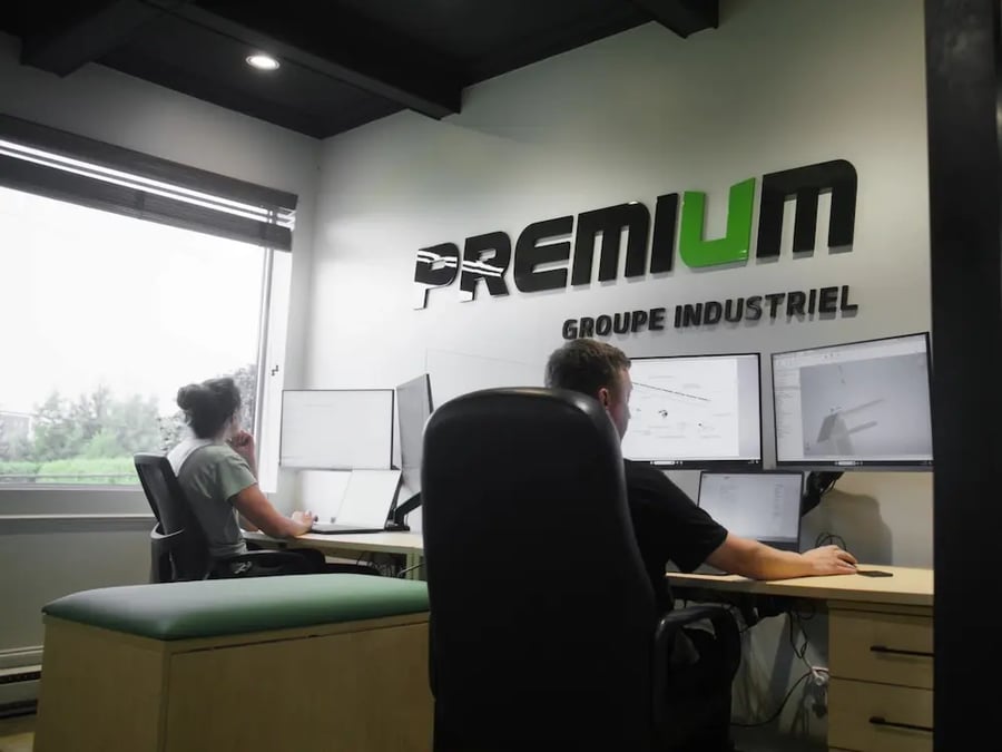 2 specialist of premium industrial group in front of there computer making overhead crane plan
