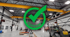 montage of an image of two overhead cranes with a seal of conformity