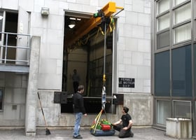 telescopic overhead crane lowering a load